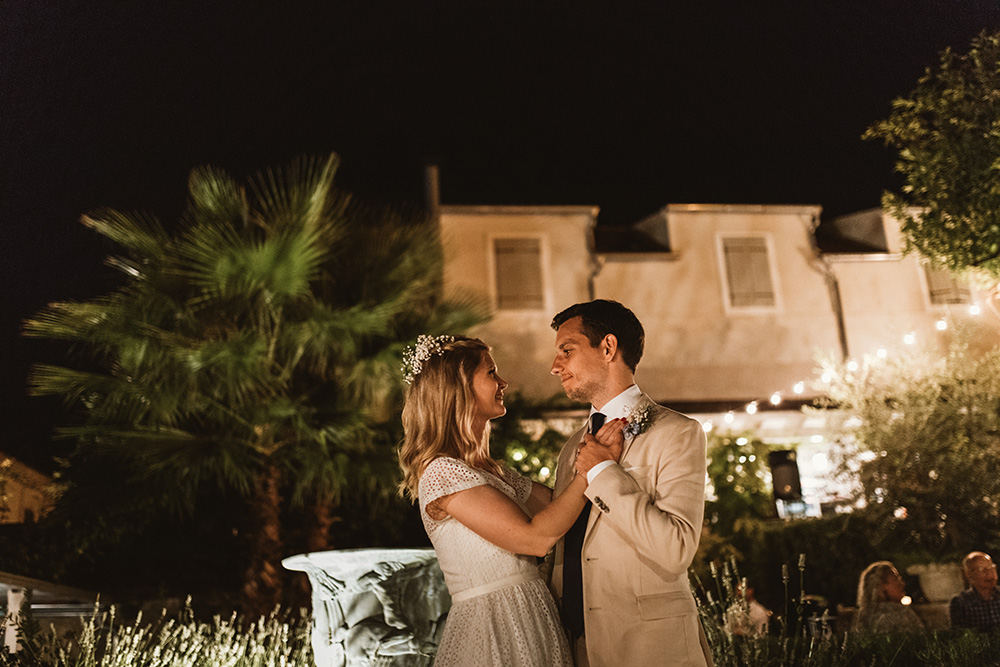 Newlyweds dancing under the stars on the terrace of Lola restaurant, beautiful outoor wedding venue on Vis Island.